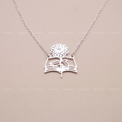 Book Birth Flower Necklace - A silver necklace with a stylised flower and book hanging from it.