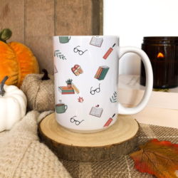 Bookworm Essentials Mug - A white mug featuring an all over pattern with an autumn book theme.